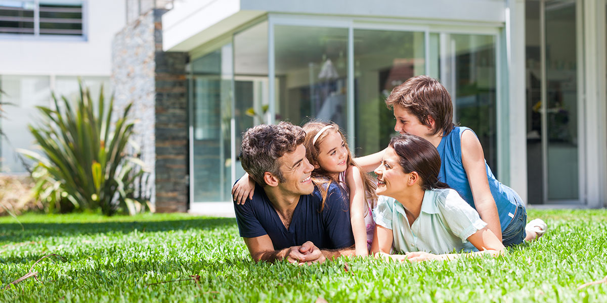 Family in front of house